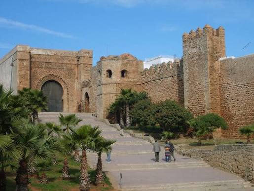 The Kasbah of the Udayas in Rabat — the blue-and-white painted streets of the ancient Almohad fortress overlooking the Atlantic Ocean and the mouth of the Bou Regreg river, one of the most visually distinctive and historically layered spaces in Morocco's capital